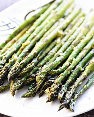 Roasted Asparagus ~ simply seasoned with olive oil, garlic, salt, and pepper for a delicious, easy, versatile, springtime side dish! | FiveHeartHome.com
