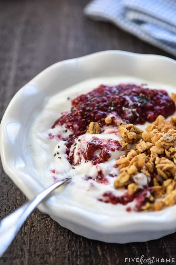 Chia Seed Jam ~ a quick, easy, delicious, and nutritious way to make jam -- without pectin or extra sugar -- using any fresh or frozen fruit you have on hand! | FiveHeartHome.com Chia Seed Jam mixed into yogurt with granola.