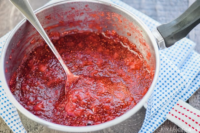 Chia Seed Jam ~ a quick, easy, delicious, and nutritious way to make jam -- without pectin or extra sugar -- using any fresh or frozen fruit you have on hand! | FiveHeartHome.com Pot of Chia Seed Jam finished cooking.