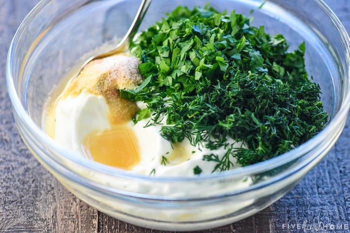 Ingredients for Greek Yogurt Dip recipe ready to mix in a bowl.