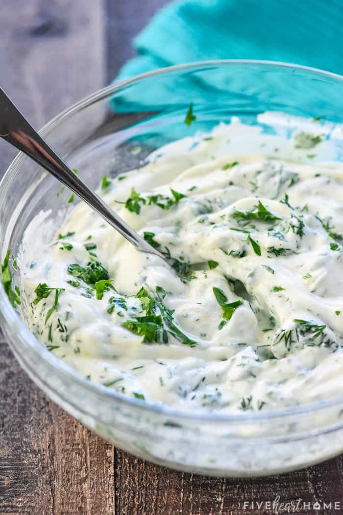 Ingredients combined in a bowl with a spoon.