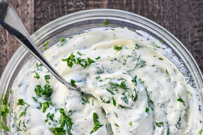 Aerial view of Greek Yogurt Dip recipe mixed with spoon.