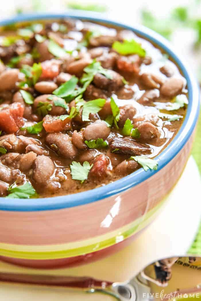 Charro Beans recipe in a bowl with cilantro on top