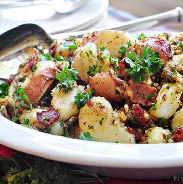 THE BEST German Potato Salad ~ a warm potato salad recipe featuring tender red potatoes and bacon in a tangy dressing for the ultimate summer side dish! | FiveHeartHome.com #germanpotatosalad