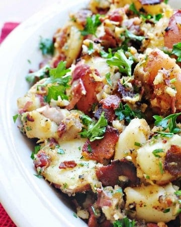 THE BEST German Potato Salad ~ a warm potato salad recipe featuring tender red potatoes and bacon in a tangy dressing for the ultimate summer side dish! | FiveHeartHome.com #germanpotatosalad