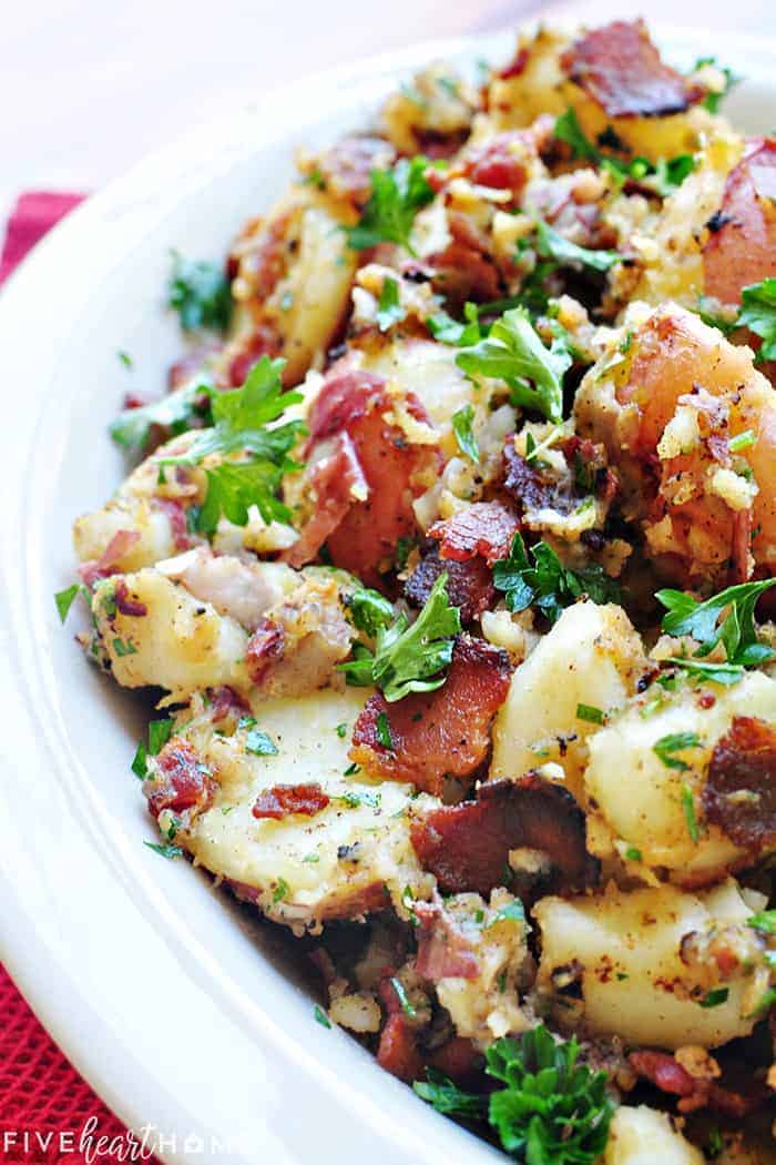 THE BEST German Potato Salad with bacon and vinegar dressing in a serving bowl