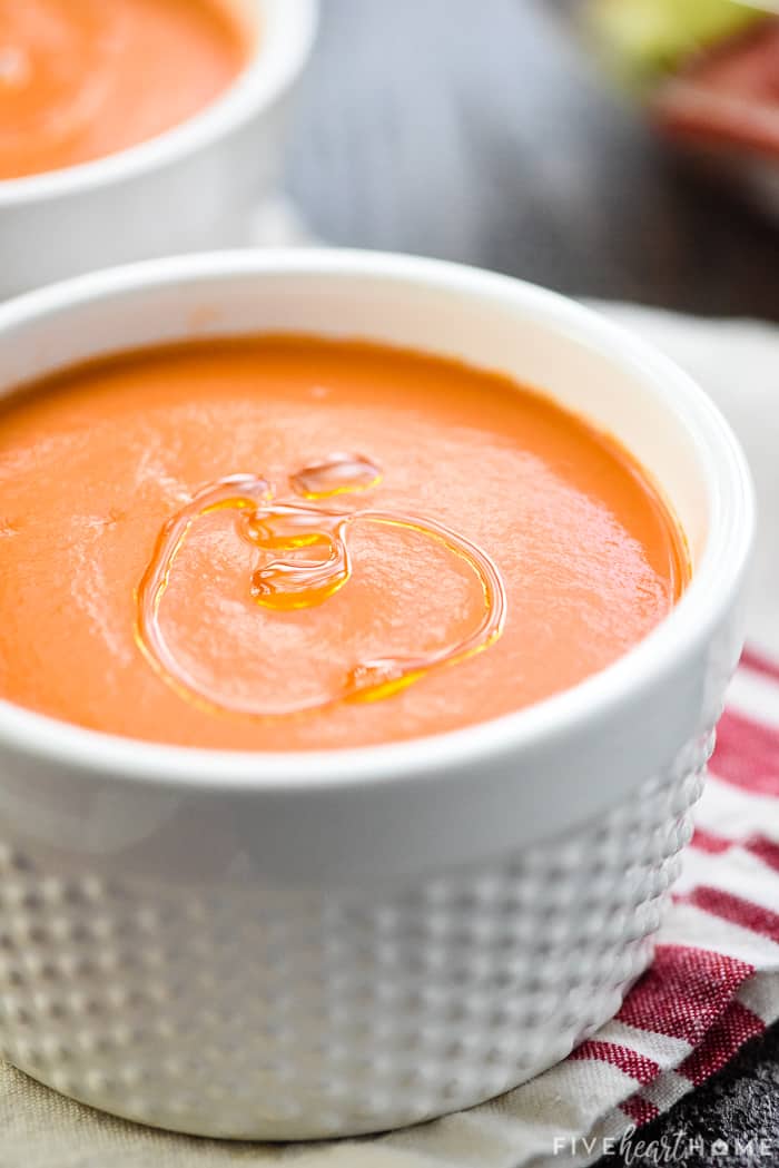 Close-up of olive oil drizzle on top of Easy Gazpacho recipe.