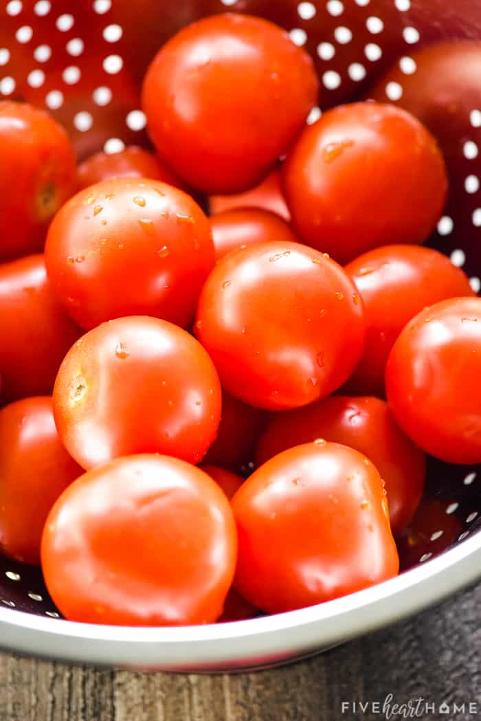 Colander of ripe tomatoes.