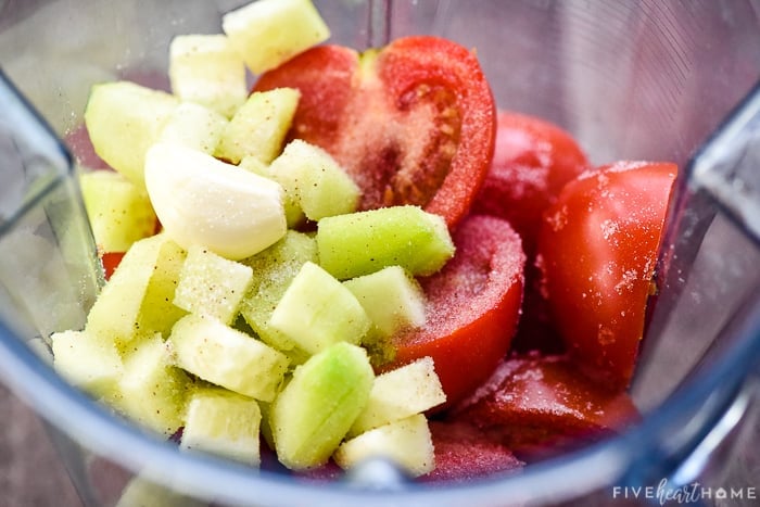 Tomatoes, cucumber, garlic, & salt in blender.