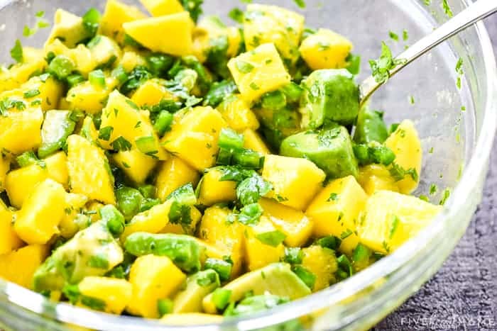 Mango Avocado Salsa recipe being mixed in bowl.