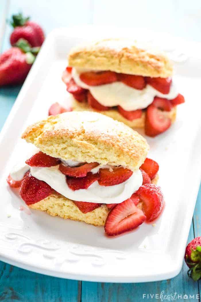 Two Homemade Strawberry Shortcakes on white serving platter.