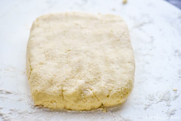 Rectangle of dough on floured board.