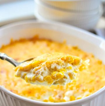 Cream Cheese Corn Casserole being scooped from serving dish.