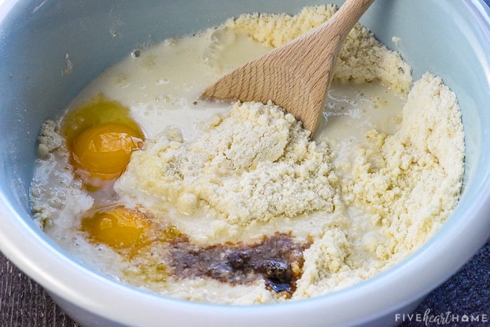 Stirring wet ingredients into dry ingredients for basic muffin recipes.