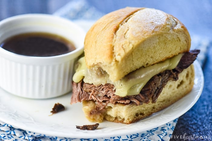 Close-up of Slow Cooker French Dip on a plate with au jus.