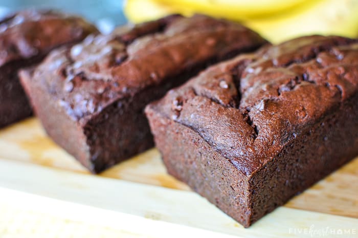 Chocolate Banana Bread loaves on wooden board.