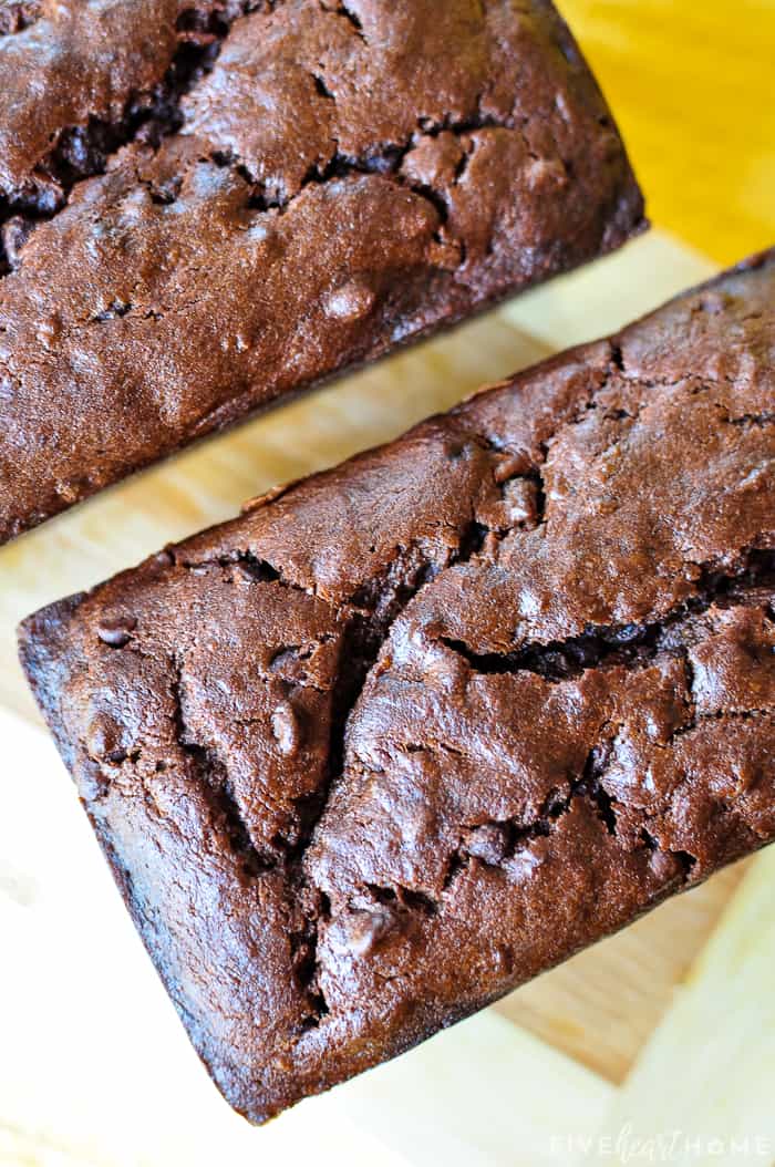 Triple Chocolate Banana Bread ~ moist, fudgy, and loaded with three kinds of chocolate, making this banana bread recipe a mouthwatering, delicious way to use up overripe bananas! | FiveHeartHome.com Aerial view of tops of two loaves