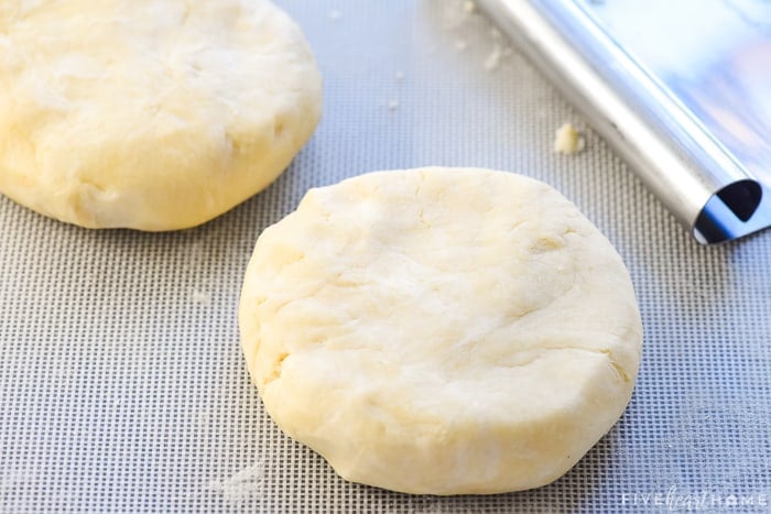 Two disks of pie crust dough.