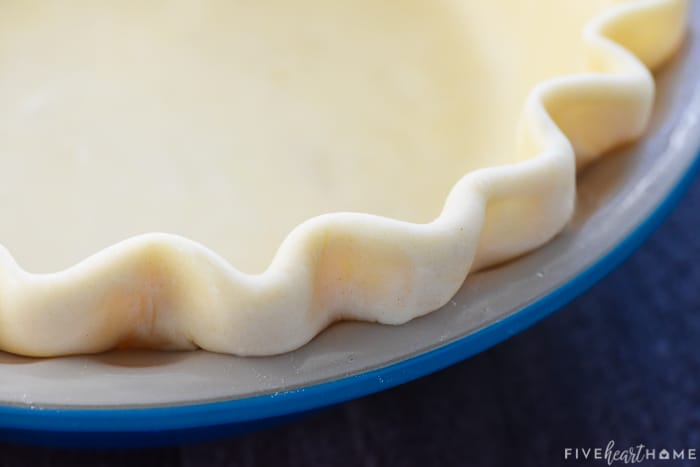 Fluted edge of Butter Pie Crust ready to go into oven.