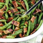Green Beans with Bacon in a dish with spoon.