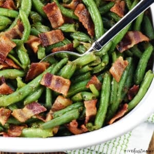 Green Beans with Bacon in a dish with spoon.