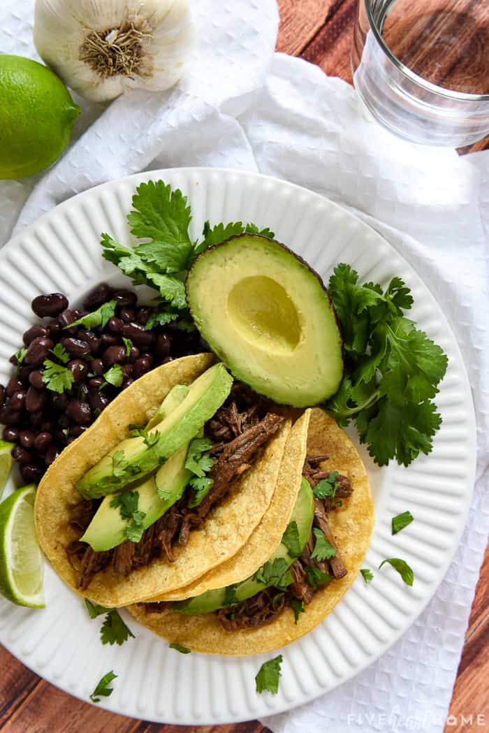 Barbacoa tacos on a plate, aerial view