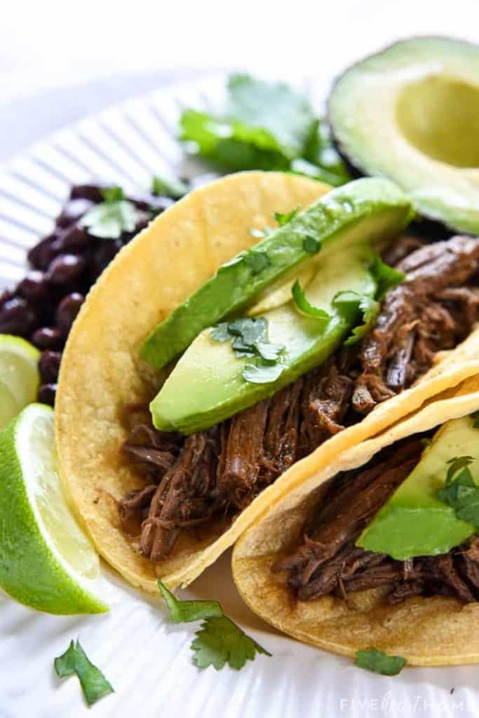 Slow Cooker Barbacoa ~ a delicious addition to tacos, burritos, rice bowls, salads, and more...and this easy, succulent, crockpot version is bursting with chipotles, garlic, cilantro, & Mexican spices! | FiveHeartHome.com