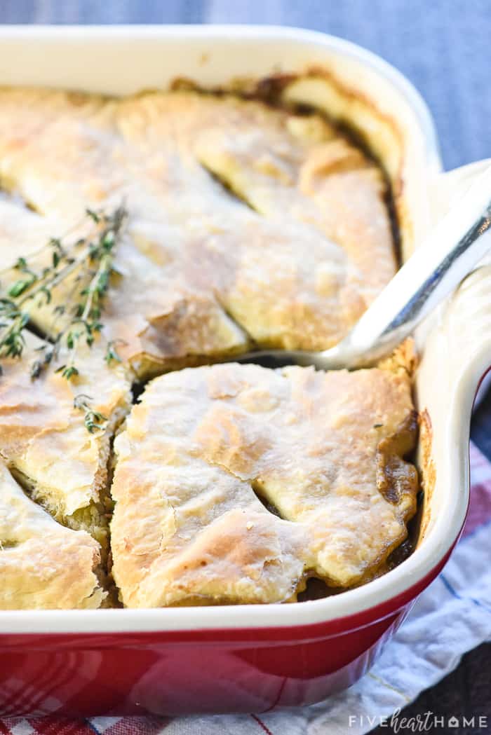 Big scoop of Beef Pot Pie being removed from baking dish.