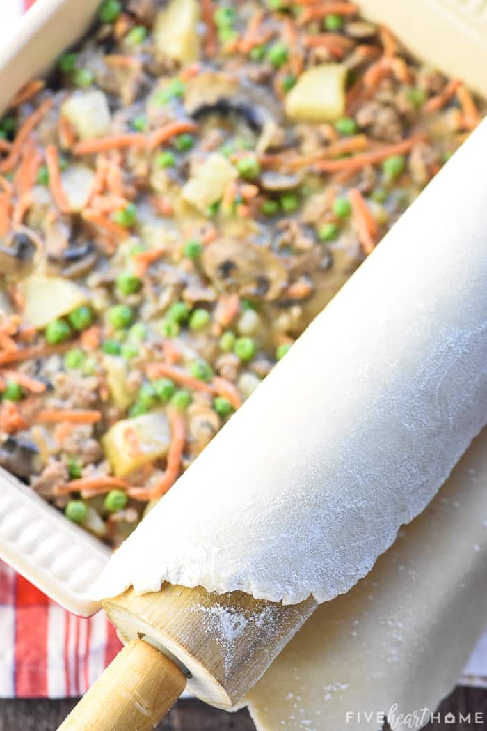 Crust being rolled on top of Beef Pot Pie.