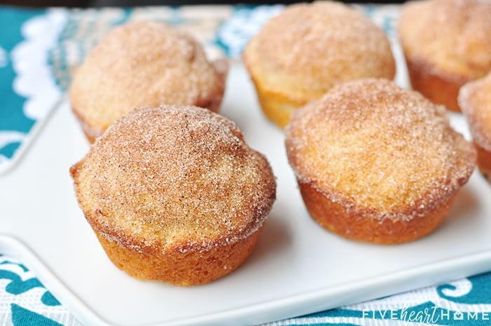 French Breakfast Puffs ~ tender vanilla muffins drenched in melted butter and dipped in cinnamon sugar for a sweet and crunchy coating that makes breakfast time a treat! | FiveHeartHome.com Lined up on a serving platter
