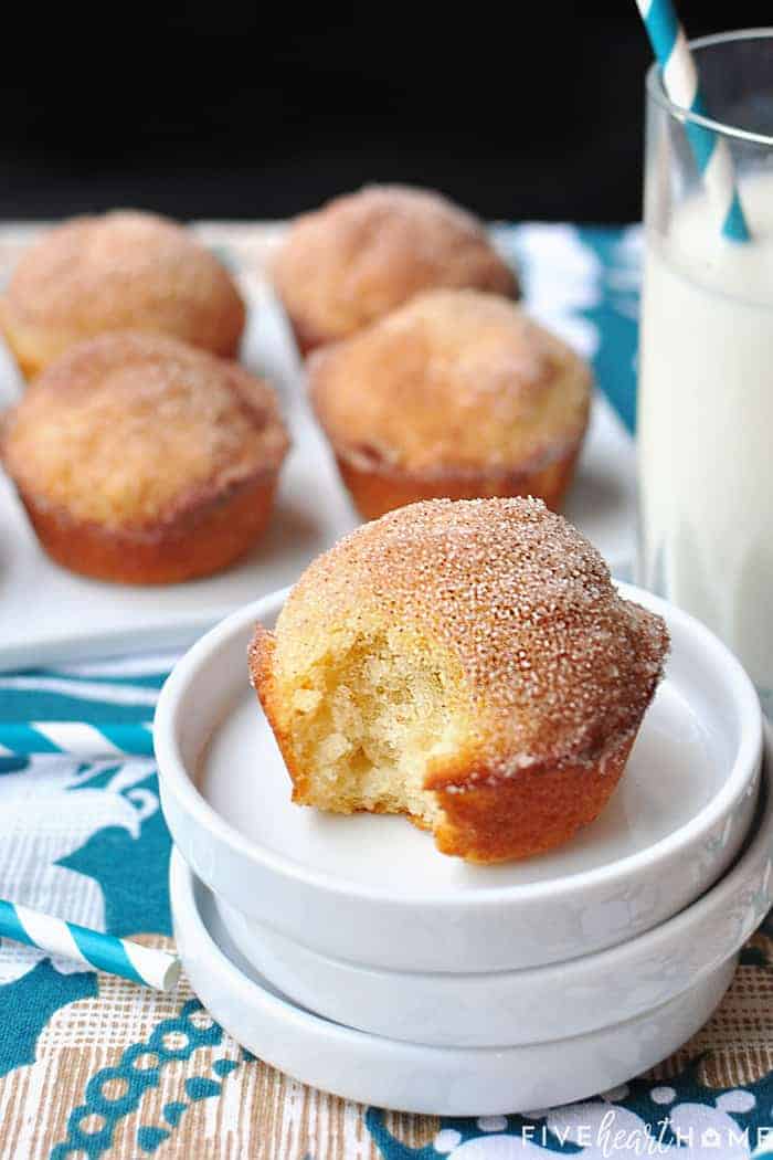 French Breakfast Puffs ~ tender vanilla muffins drenched in melted butter and dipped in cinnamon sugar for a sweet and crunchy coating that makes breakfast time a treat! | FiveHeartHome.com French Breakfast Puffs with glass of milk