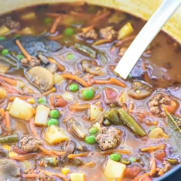 Close-up of Hamburger Vegetable Soup in pot with ladle.