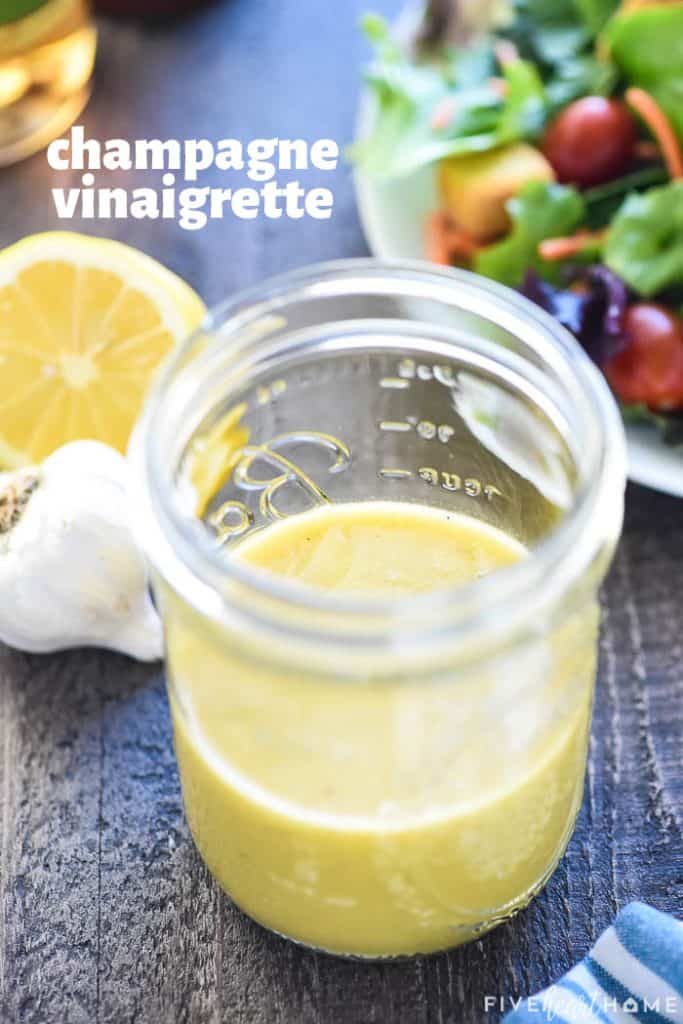 Champagne Vinaigrette in a jar with text overlay.