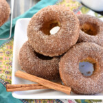 Baked Apple Cider Donuts piled on plate.