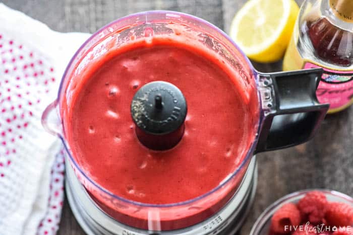 Aerial shot of Raspberry Vinaigrette blended together in mini food processor.