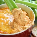 Chicken Wing Dip being scooped up by celery.