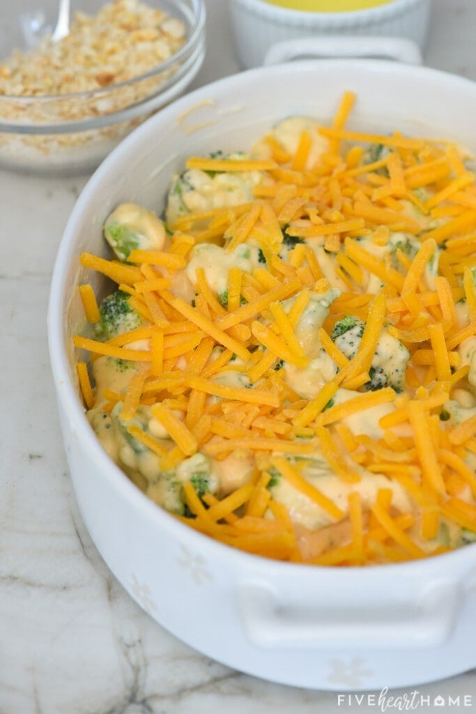 Shredded cheddar sprinkled on top of baking dish.