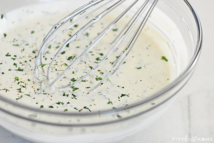 Close-up of How to Make Ranch Dressing using a whisk.