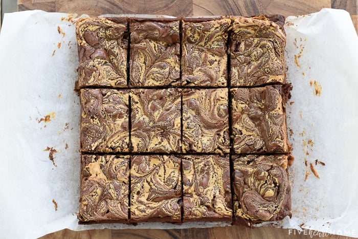 Aerial view of gluten-free Peanut Butter Brownies on parchment paper cut into bars.