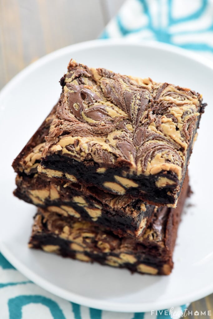 Close-up fo stack of Peanut Butter Brownies on plate.