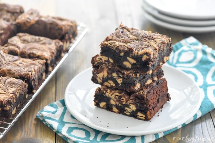 Peanut Butter Brownies on plate with more on cooling rack in background.