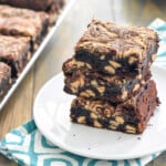 Peanut Butter Brownies stacked on a white plate.