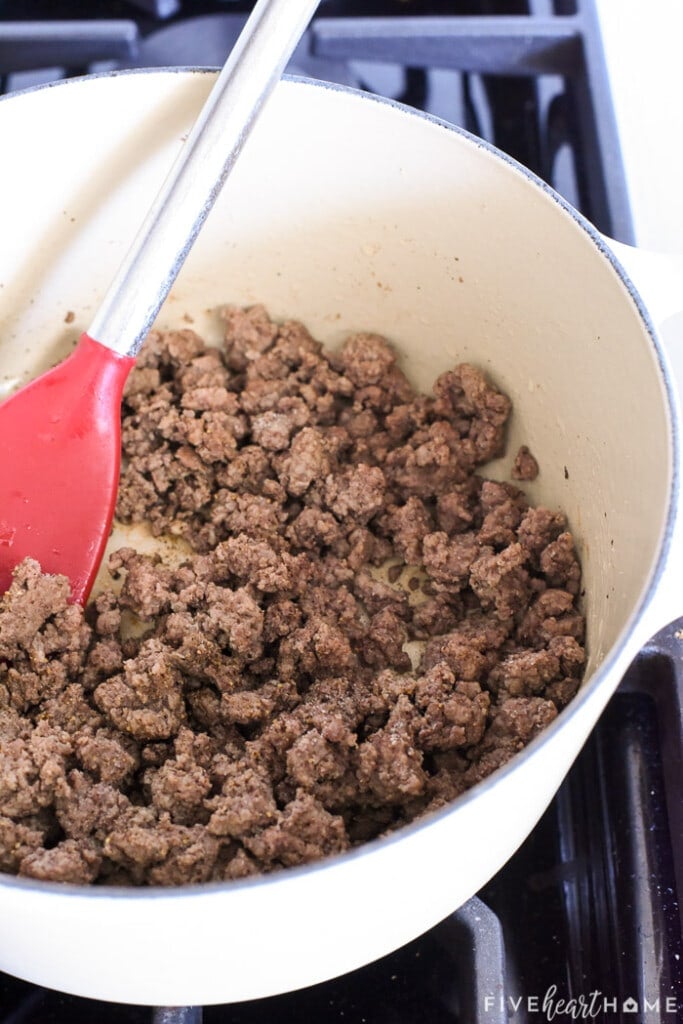 Cooked ground beef in pot.