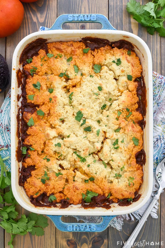 Tamale Pie ~ this easy dinner recipe features a zesty, flavorful ground beef filling with a delicious baked topping made of masa. The result is meal that tastes amazingly like a beef tamale and can easily be made gluten-free! | FiveHeartHome.com via @fivehearthome