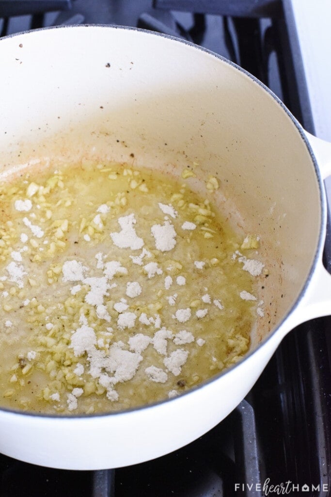 EVOO, garlic, and flour in pot.