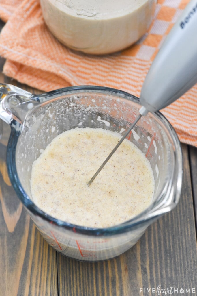 Using a milk frother to foam the Pumpkin Cream.