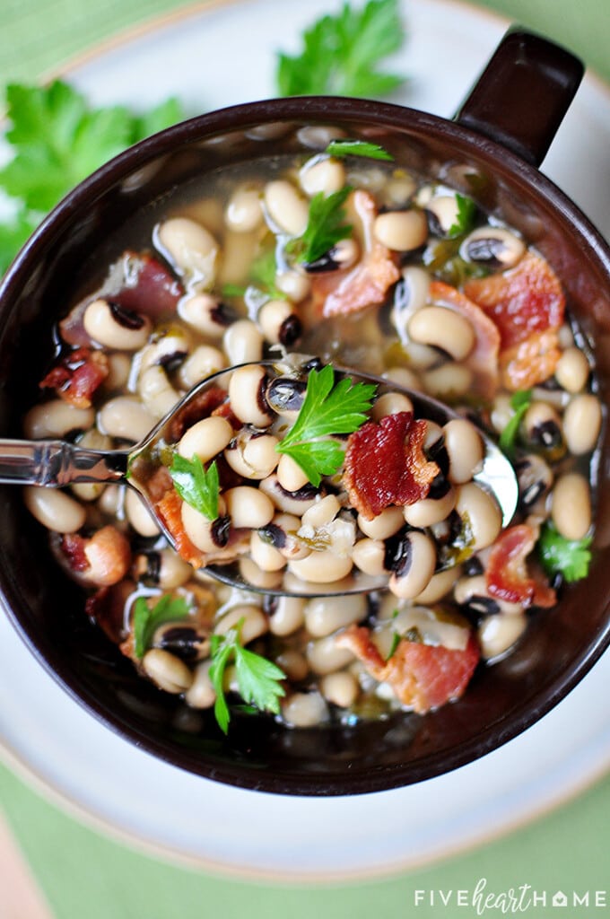 New Year's black eyed peas recipe with spoon over bowl.