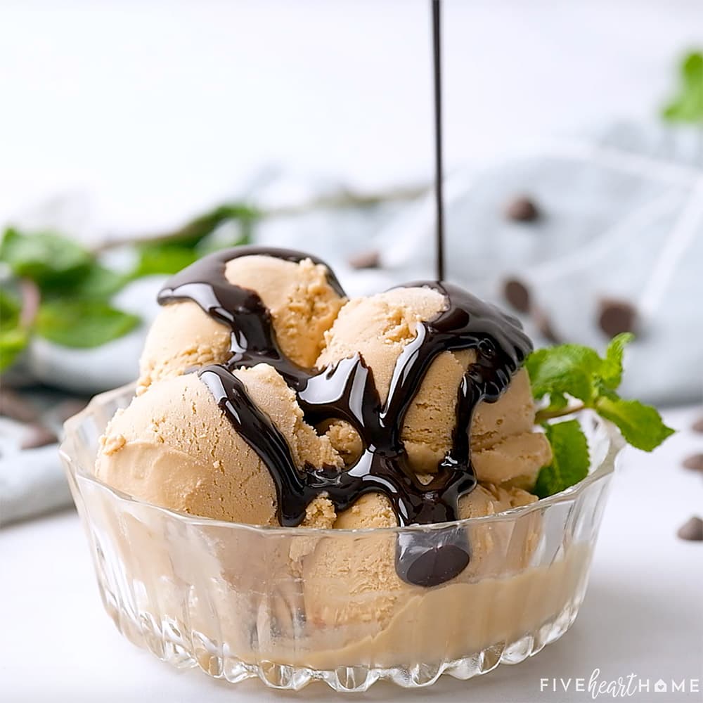 Chocolate Syrup being drizzled over ice cream.