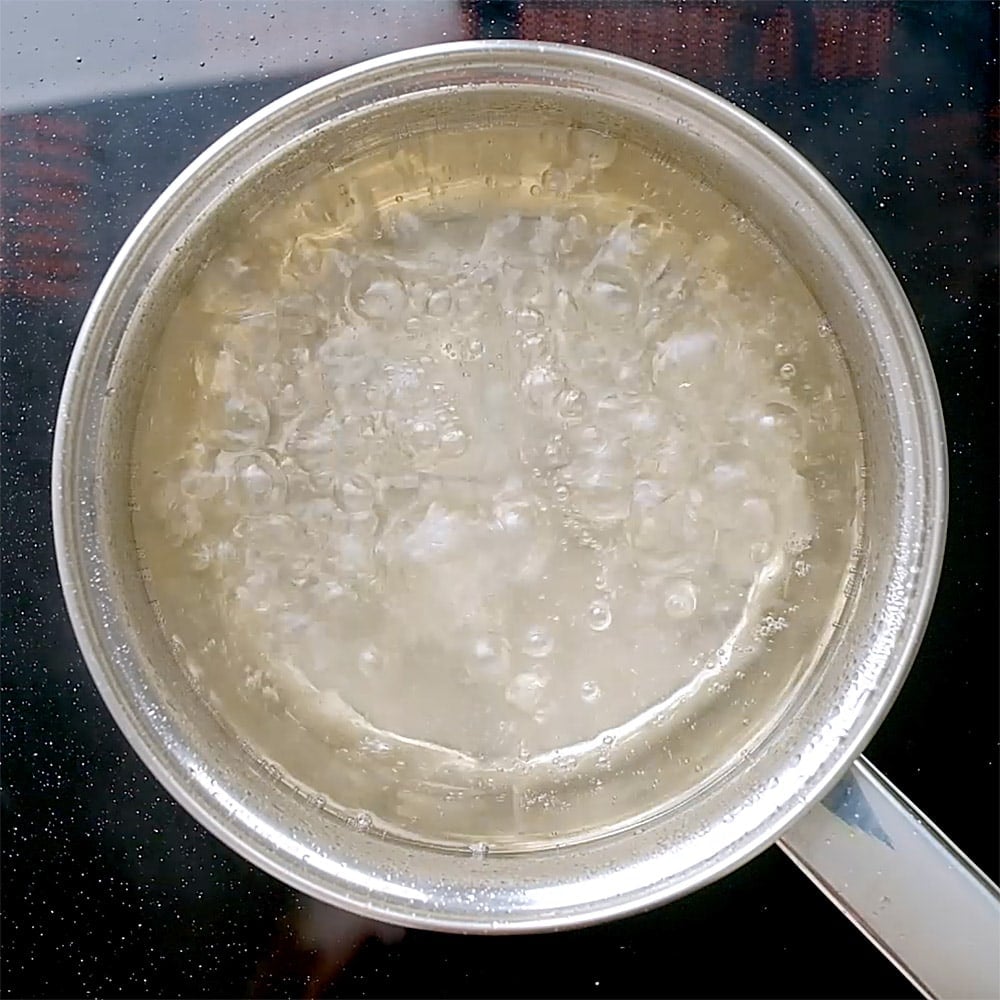 Aerial view of sugar and water simmering.