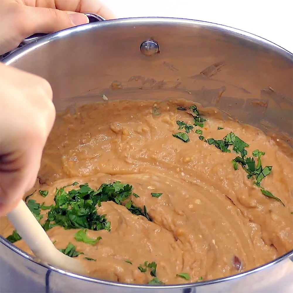 Stirring in cilantro.